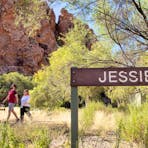 Visitors walking past a sign saying Jessie Gap