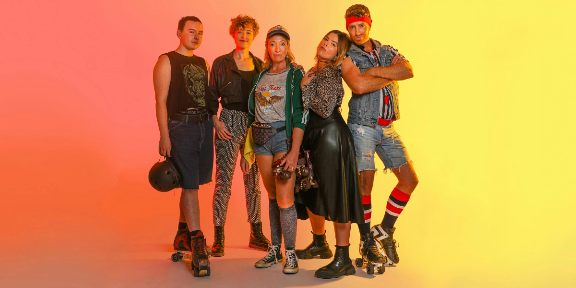 Five members of the cast, posing, in costume