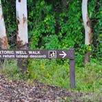 Directional signage along the walkway between the carpark and the Window on the Wetlands display.