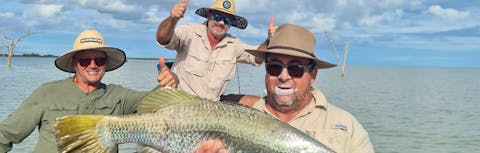 A group of men barramundi fishing.