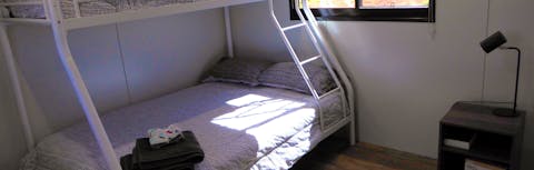 Single bed over double bunk