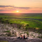 Couple enjoying the sunset at Ubirr