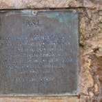 Brass plaque fixed to the memorial.