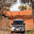Driving over red sand dunes on Binns Track in the Simpson Desert
