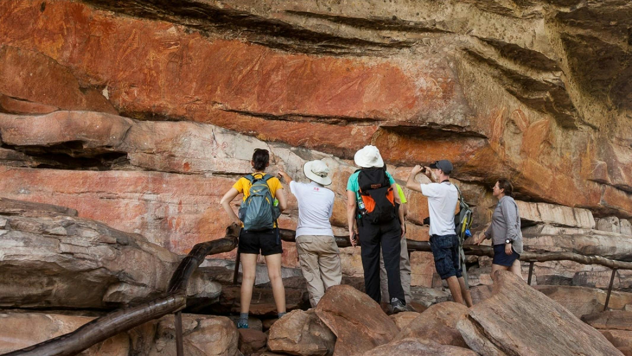 A group viewing rock art at Nourlangie Rock