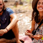 Woman and man happily painting on bark