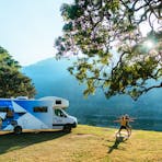 Couple practising yoga by Star RV motorhome