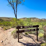 Signs along the Larapinta Trail showing directions to Redbank Gorge
