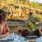 Woman enjoying the Nabilil Dreaming Sunset Cruise on Nitmiluk Gorge