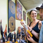 A couple admiring Tiwi art pieces