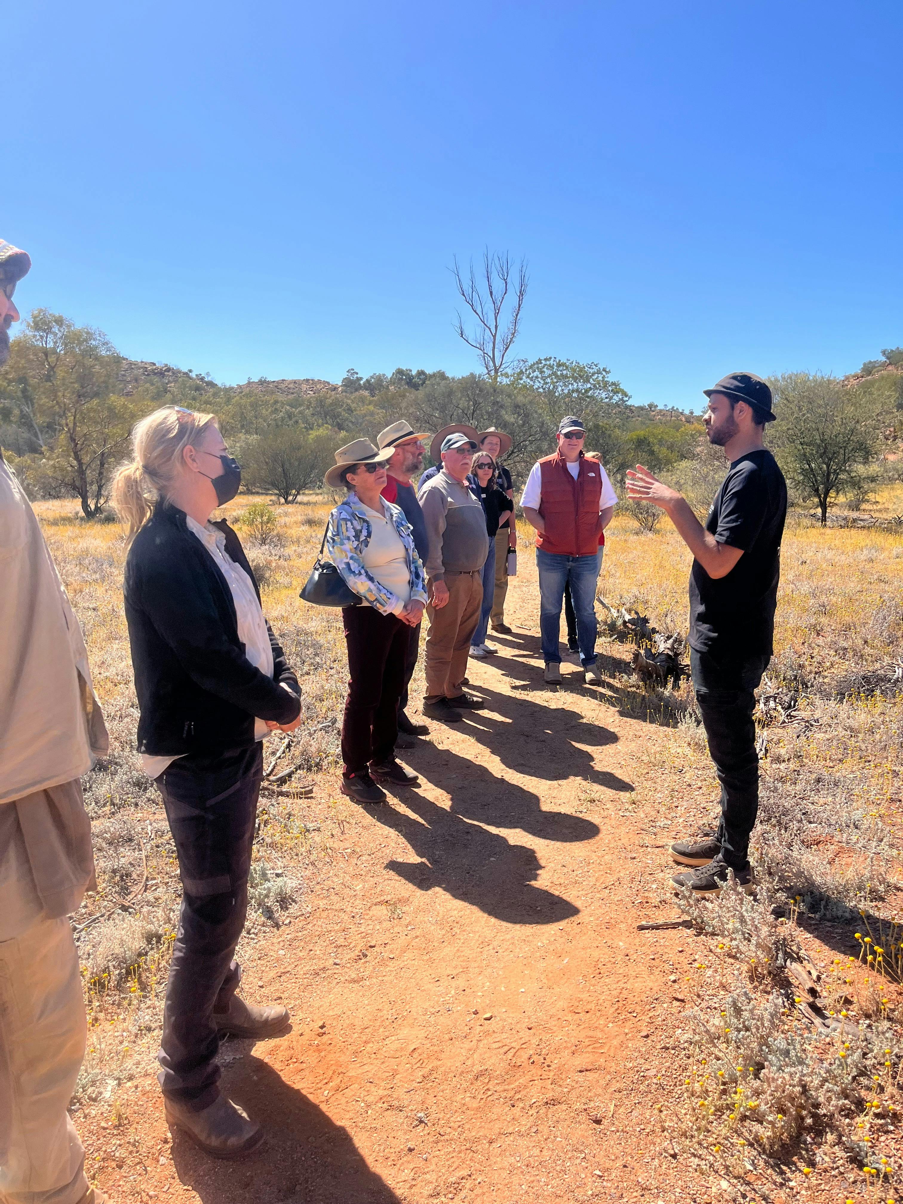 William Palmer on tour with visitors at Olive Pink Botanic Garden