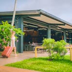 Woman with suitcase checking in at Litchfield outback resort