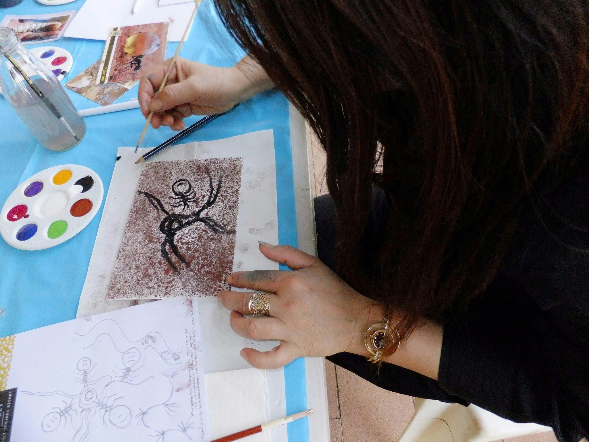 Customer trying their hand at sand painting