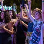 Crowd cheering in front of stage