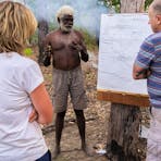 Teddy teaching guests on-country