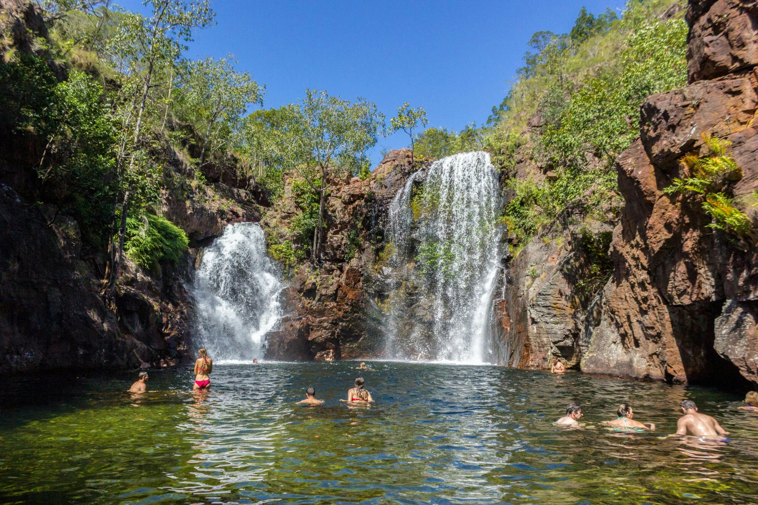 People swimming in Florence Falls in Litchfield National Park