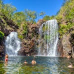 People swimming in Florence Falls in Litchfield National Park