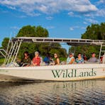 Cruising Corroboree Billabong on a custom-made boat
