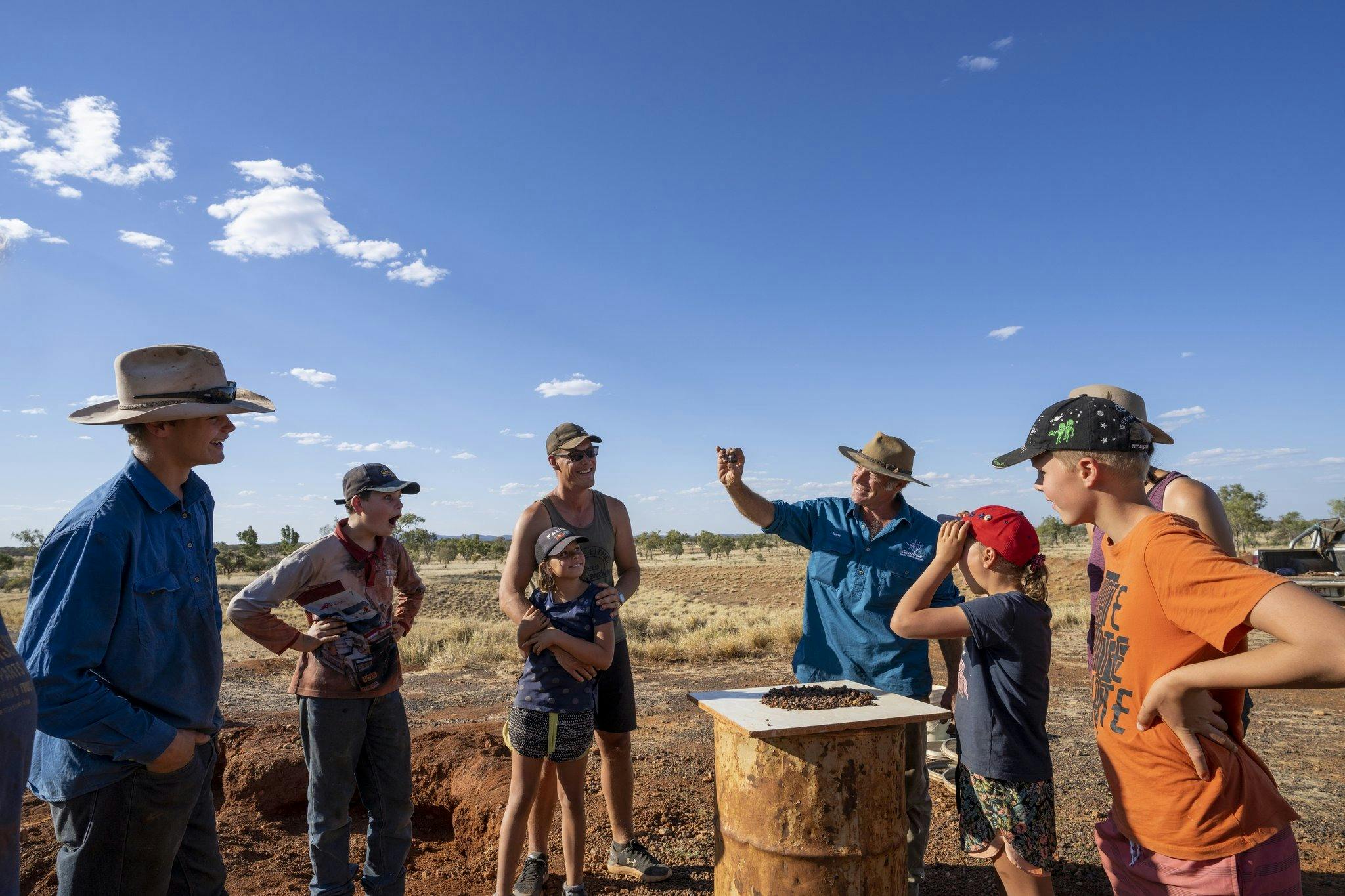 People fossicking for zircons