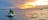 Sunrise over the ocean with one loan jet ski