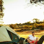 Family enjoying a meal together at the Ayers Rock Campground BBQ facilities