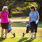 Lovely ladies playing a game at gardens park golf links