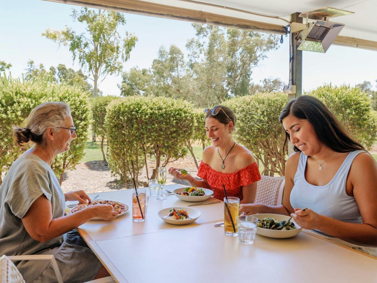 Three people eating their meal at Geckos Cafe