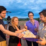 Visitors sampling canapes at the Earth Sanctuary, Alice Springs