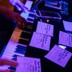 Duelling piano at Sweethearts with song request sheets on