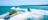 three jet skis on the water forming s bends