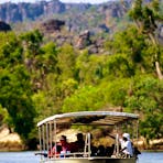 Boat coming up the East Alligator River, Kakadu