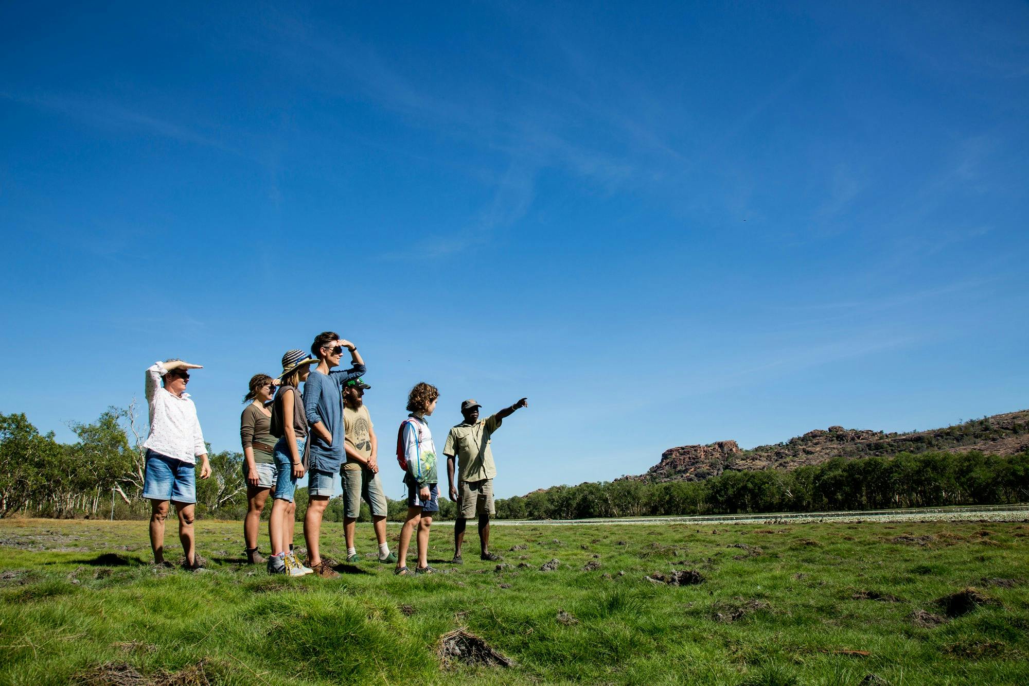 Walking across a wetland together with a Traditional Owner in Kakadu
