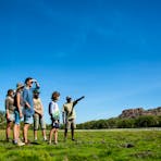Walking across a wetland together with a Traditional Owner in Kakadu