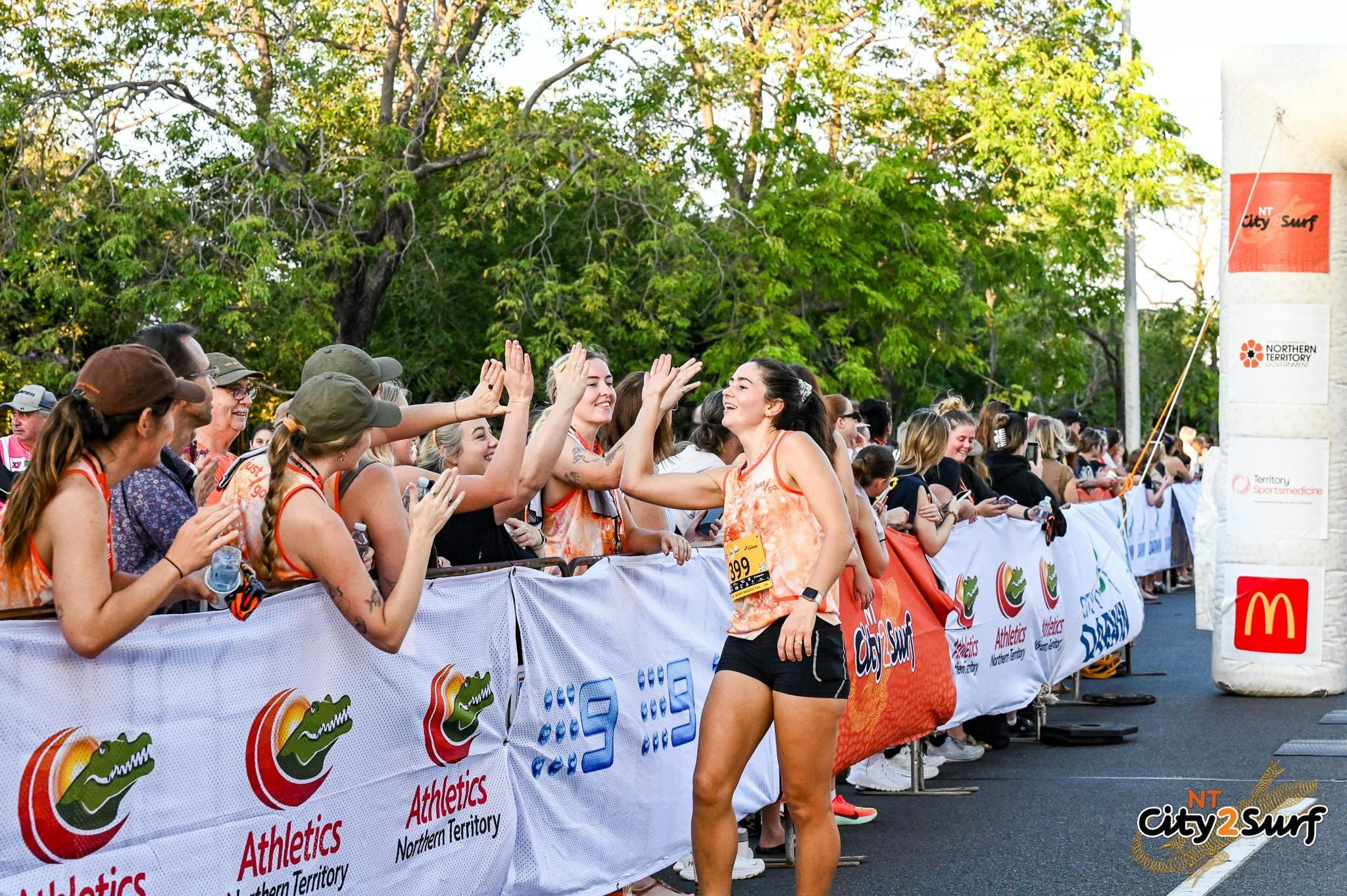High fiving at the finish line