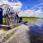 Action shot of people air boating down Mary River
