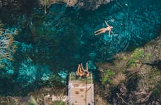 Aerial view of people swimming in thermal pool