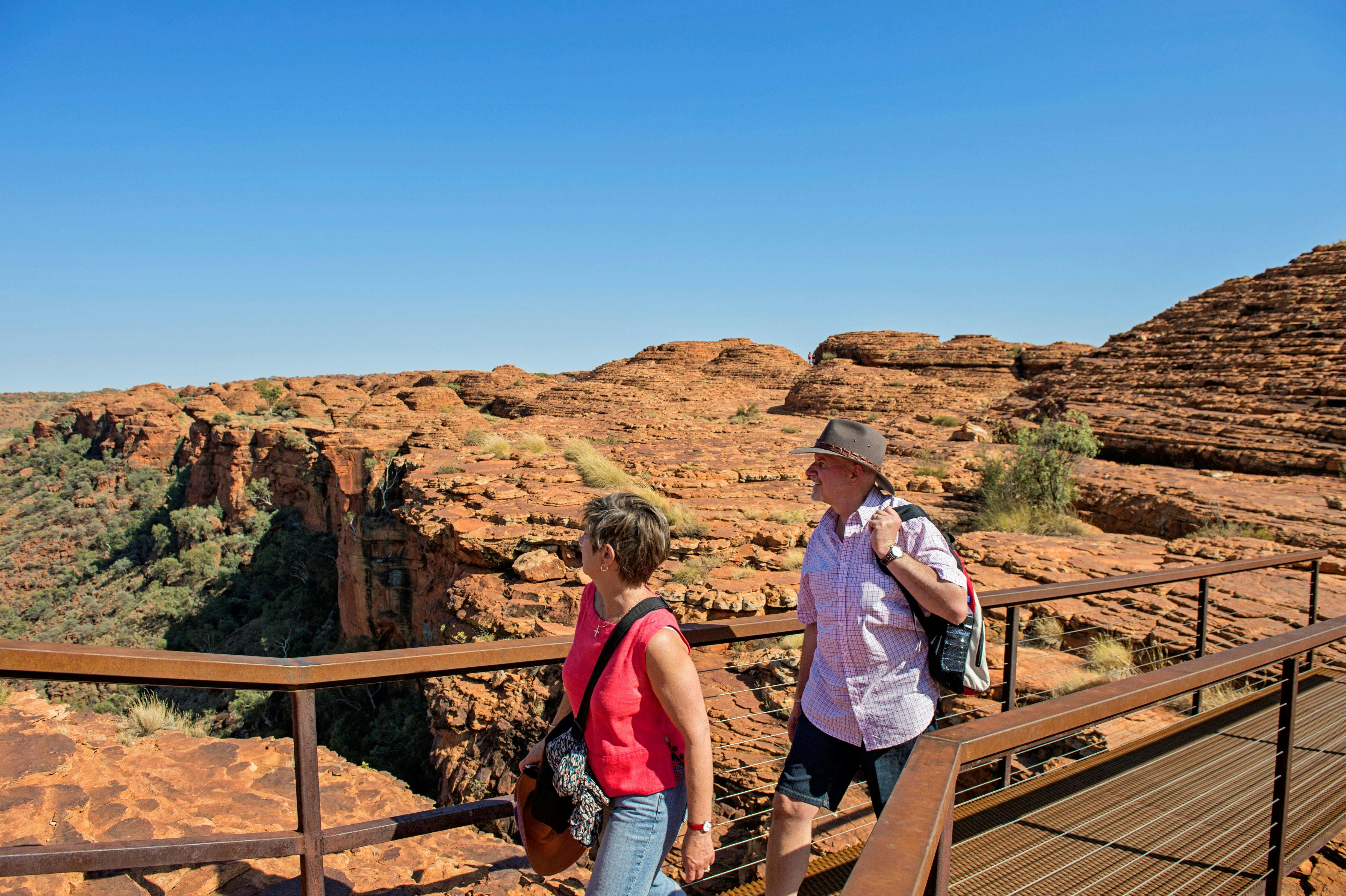A man and a woman crossing a pedestrian bridge enjoying the view over Kings Canyon