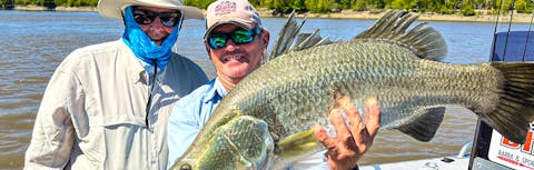 Two men with a Barramundi