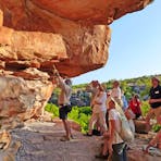 Guest Lecturer Showing Guests Ancient Rock Art At Swift Bay