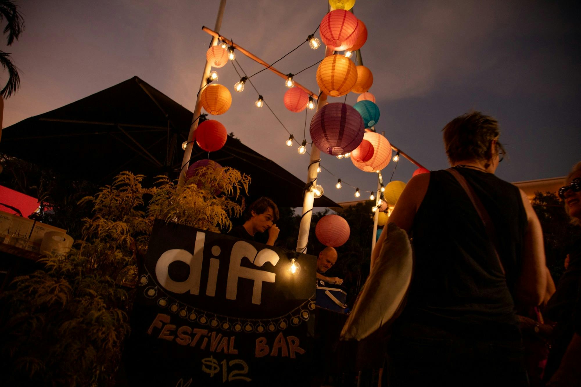 Customers order cocktails at the DIFF bar