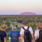 Walking along desert trails to Uluṟu
