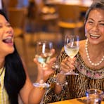 Two ladies enjoying relaxed dining at The Vue restaurant in Mindil Beach Casino Resort