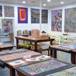 Loose paintings, artifacts, historic items, Zebra stone, wooden vases, artist feature wall.