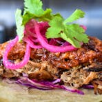 Shredded pork shoulder taco