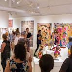 crowds looking at Aboriginal art works and soft sculptures