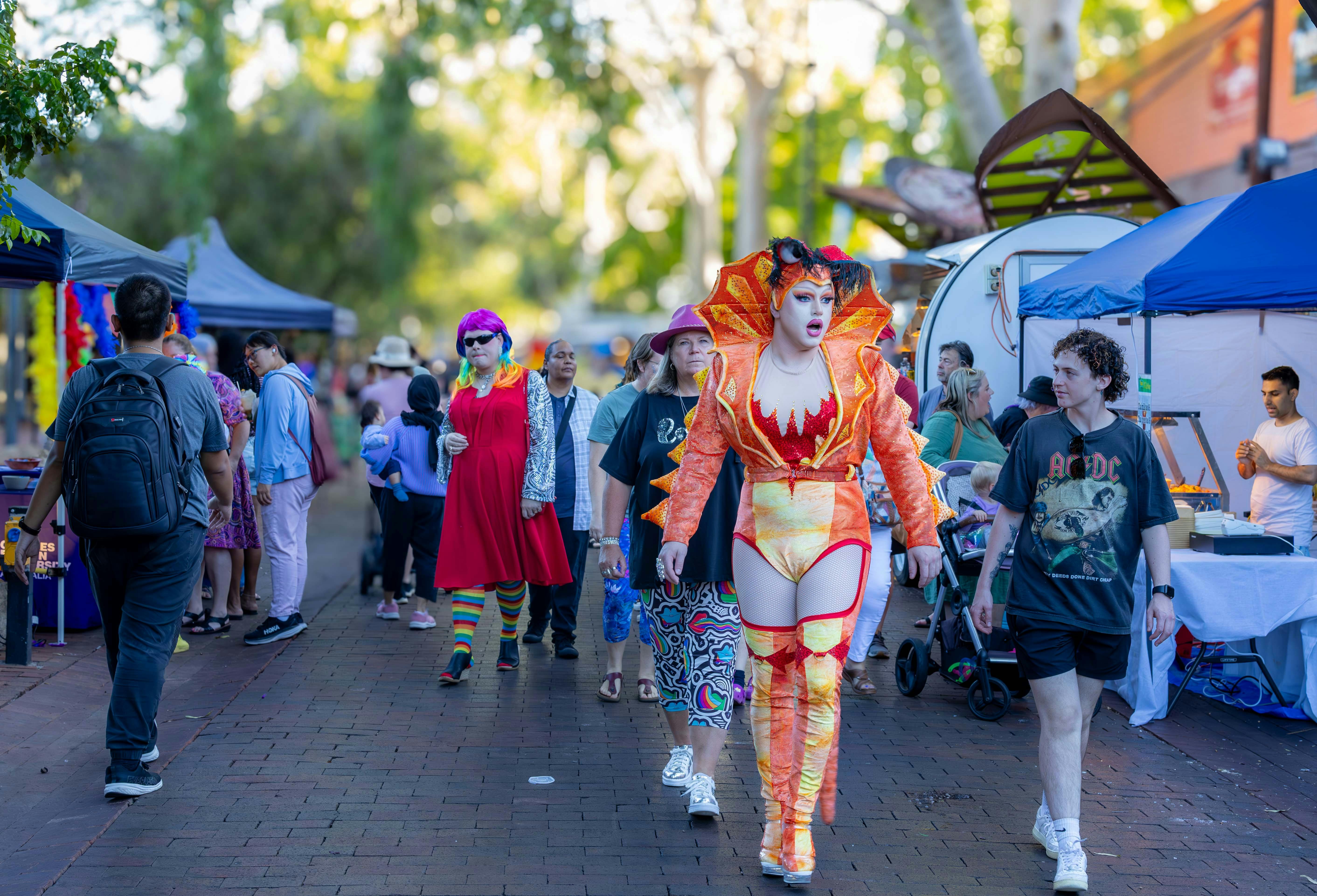 A Drag Queen + people at the Mall Markets in Alice Springs