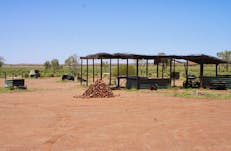 General view of camping area facilities, including barbecues and bush kitchen, for use by visitors.