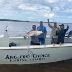 Happy customers with a nice saltwater barraundi that measured over 1 metre