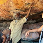 Traditional Owner interpreting the main gallery at Injaluk Hill in Western Arnhem Land