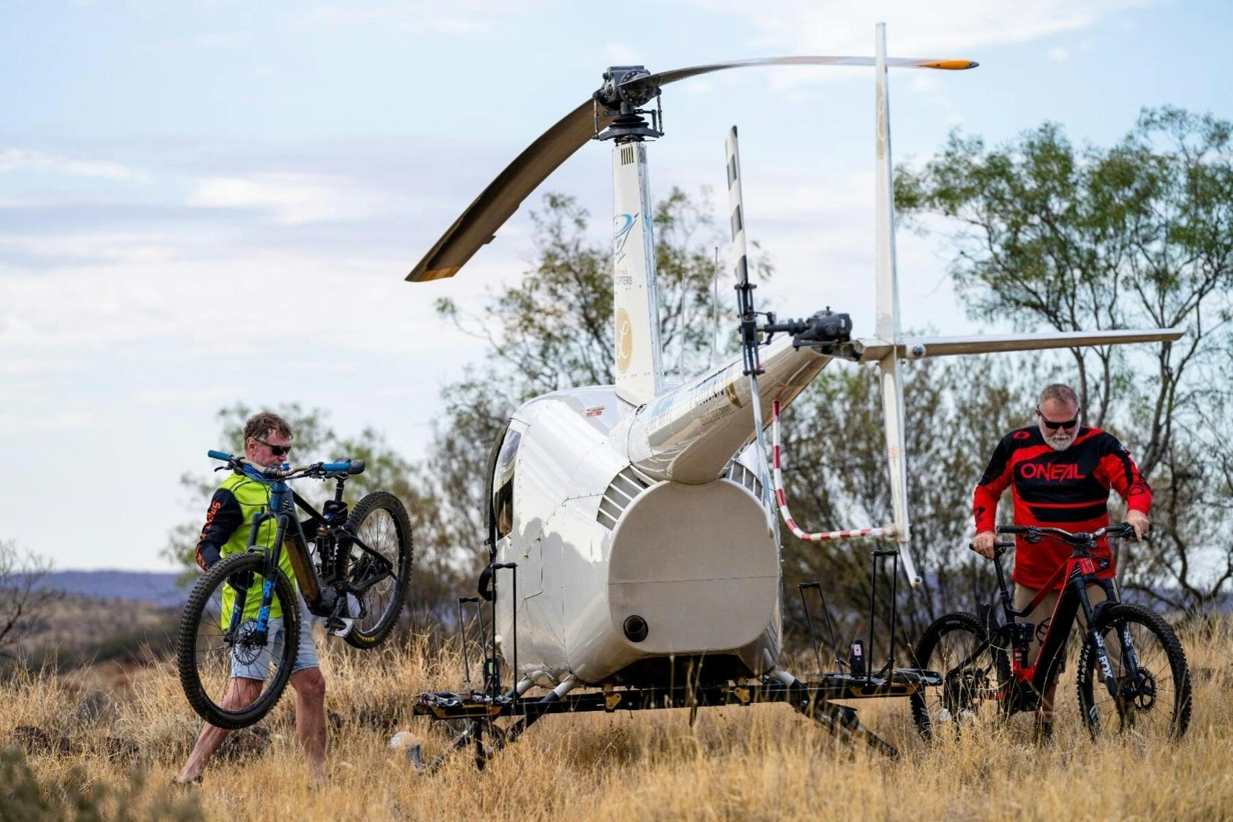 Riders unloading bikes from helicopter